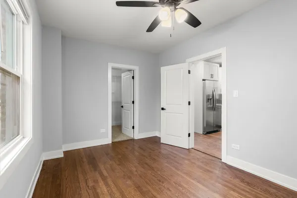 a view of walk in closet with empty racks