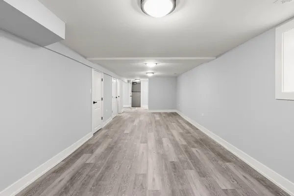 a room with a sink and cabinets