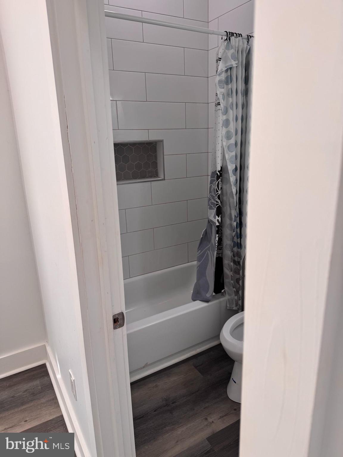 4906 Harford Road Baltimore, MD 21214 - Photo 29 of 31 a bathroom with a toilet and a shower