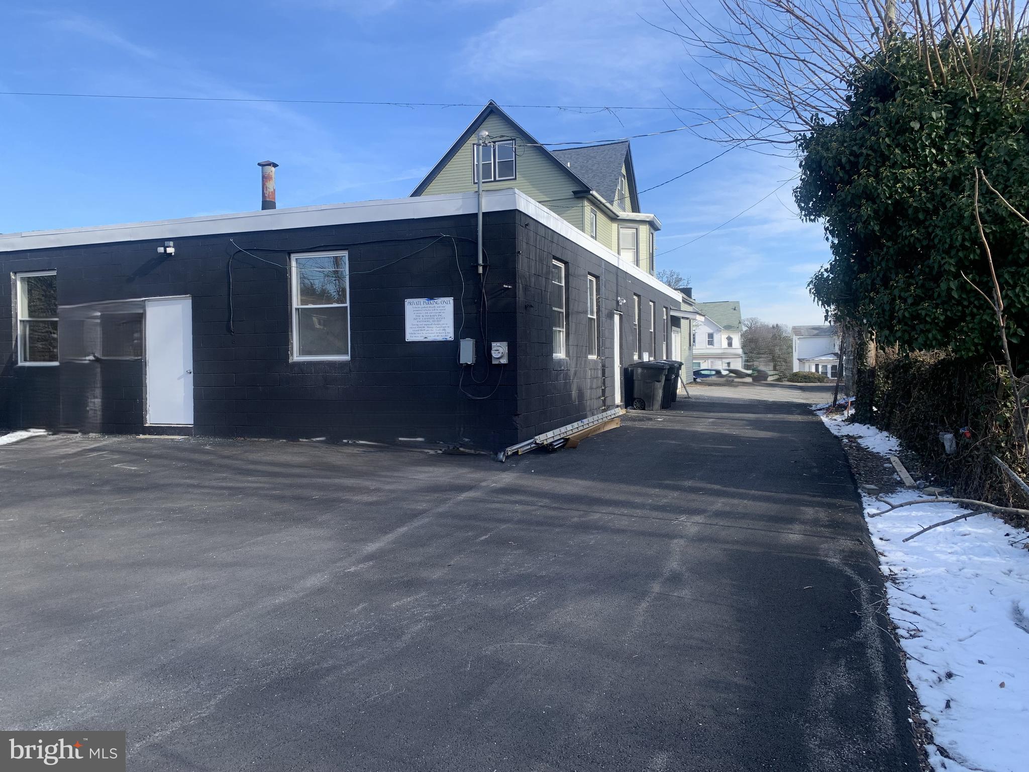 4906 Harford Road Baltimore, MD 21214 - Photo 6 of 31 a front view of a house with a yard