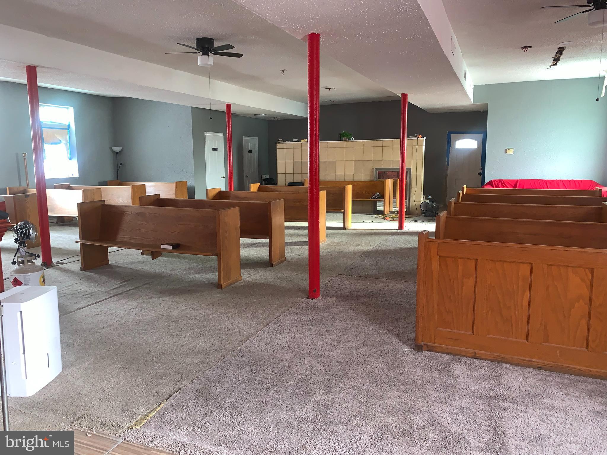 4906 Harford Road Baltimore, MD 21214 - Photo 9 of 31 a living room with furniture and a flat screen tv