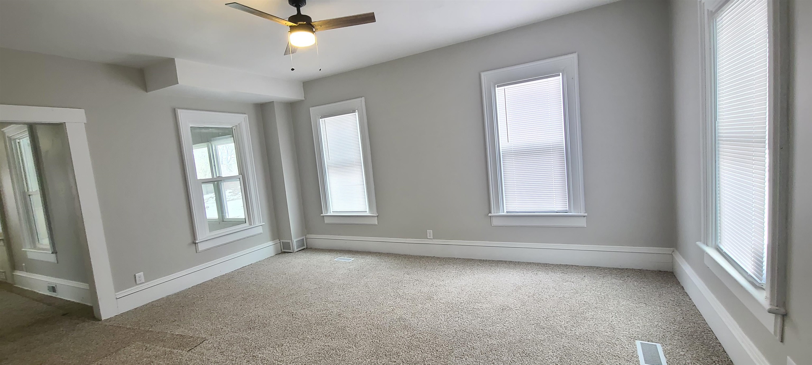 894 Bend Road Dixon, IL 61021 - Photo 13 of 23 an empty room with windows and fan