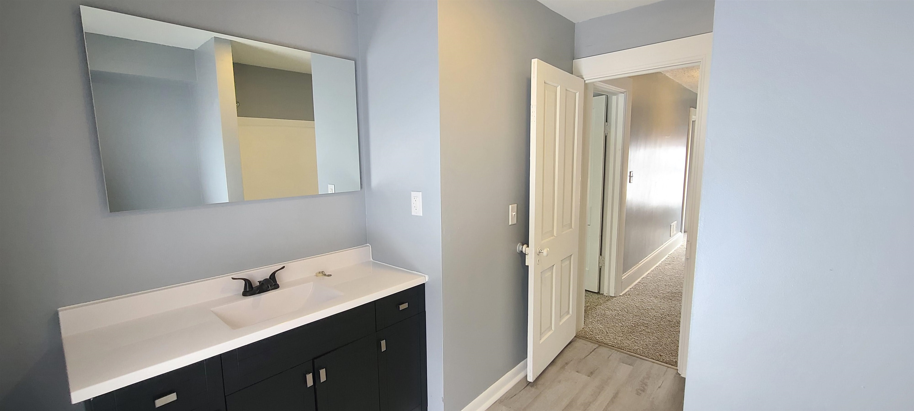 894 Bend Road Dixon, IL 61021 - Photo 20 of 23 a bathroom with a sink and a mirror