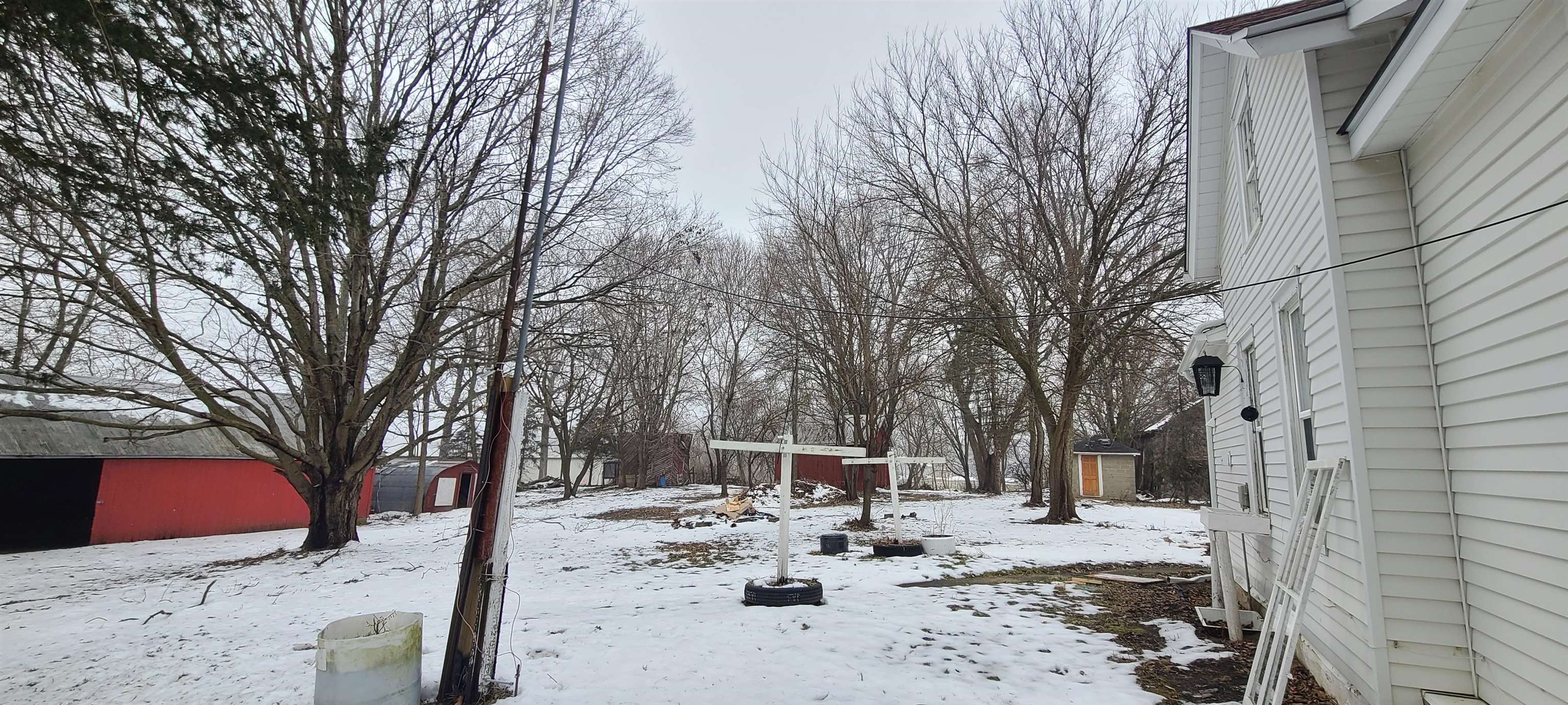 894 Bend Road Dixon, IL 61021 - Photo 3 of 23 a view of a backyard with snow on the road