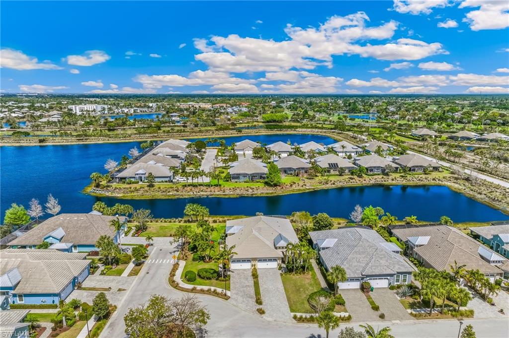 6939 Cay Court Naples, FL 34113 - Photo 24 of 31 Aerial perspective of suburban area featuring a nearby body of water