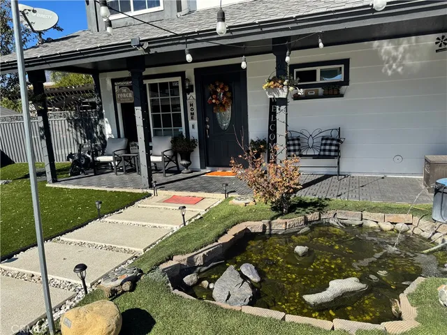 a view of a patio with table and chairs in the patio