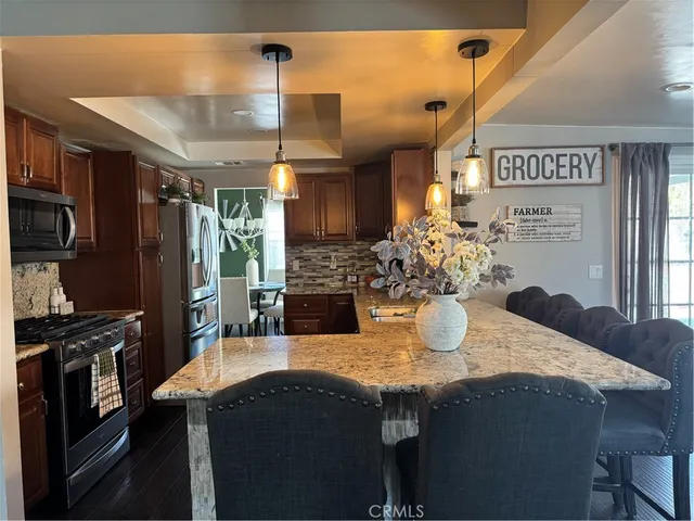 a kitchen with a table and chairs