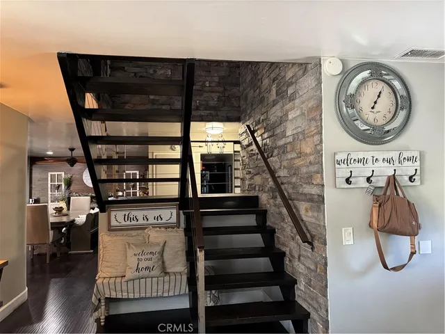a view of entryway with wooden floor