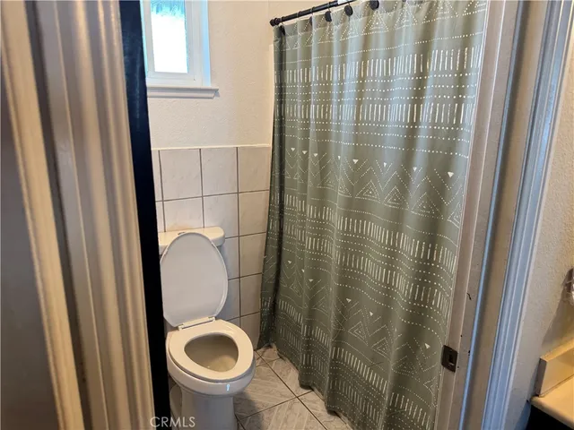 a bathroom with a toilet and a sink