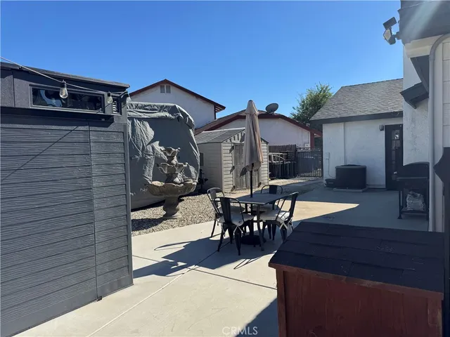 a view of a house with sitting area and furniture