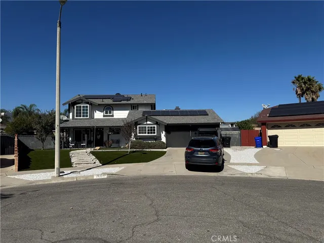 a view of a car park in front of house