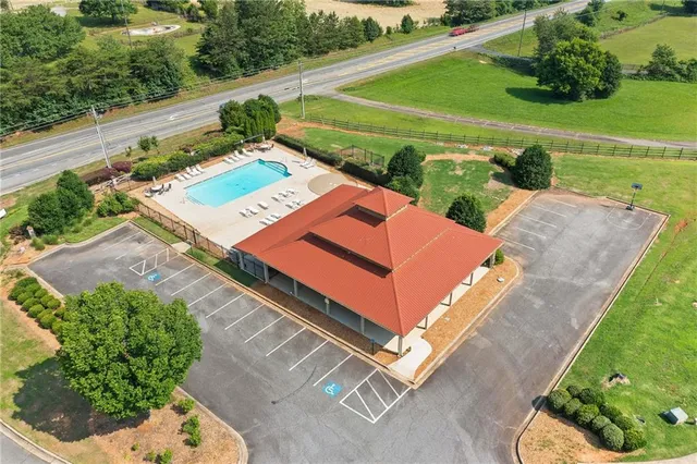 an aerial view of a house with a garden and outdoor space