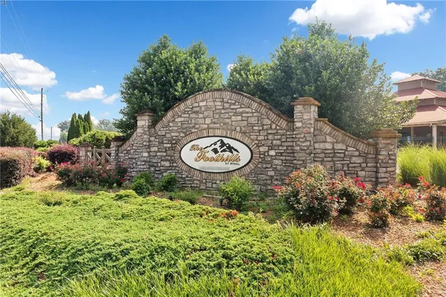 a backyard of a house with a yard and outdoor seating