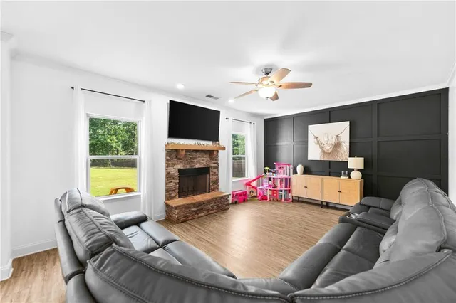 a living room with furniture or fireplace and a flat screen tv