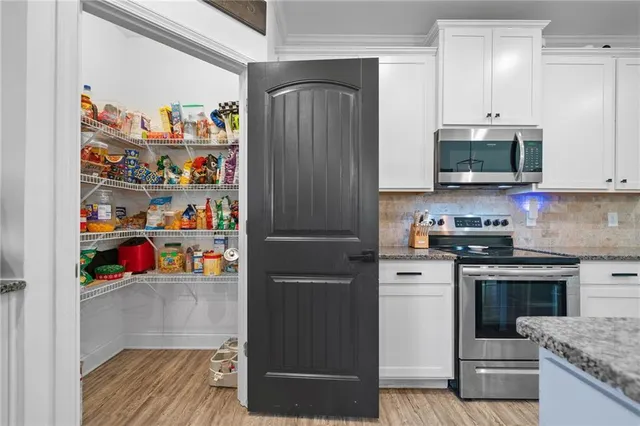 a view of hallway with windows