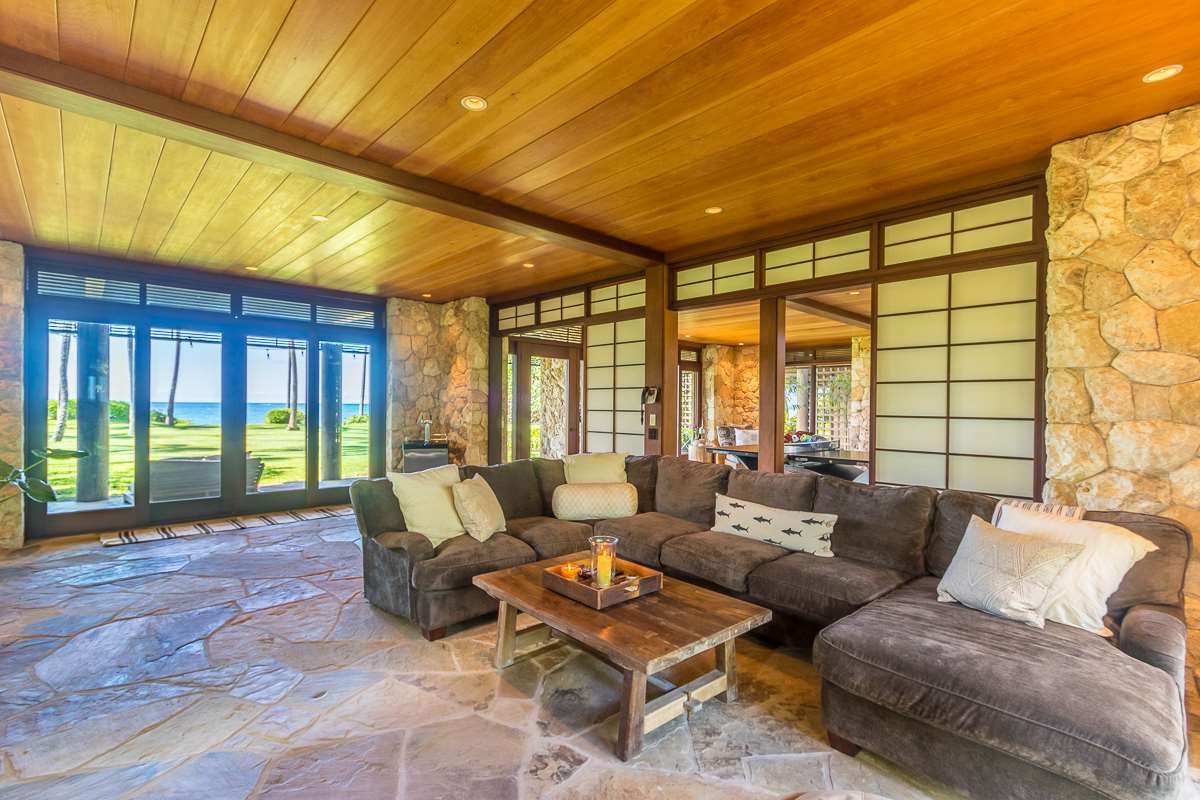 600 Stable Road Paia, HI 96779 - Photo 18 of 30 a living room with furniture and a floor to ceiling window