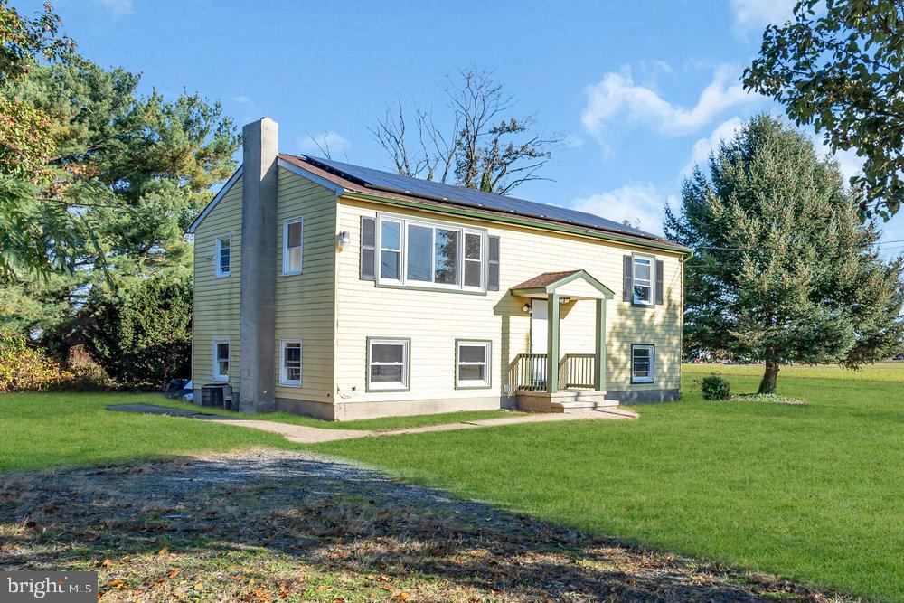 76 Rockville Road Bridgeton, NJ 08302 - Photo 5 of 5 Charming home with lush green surroundings.