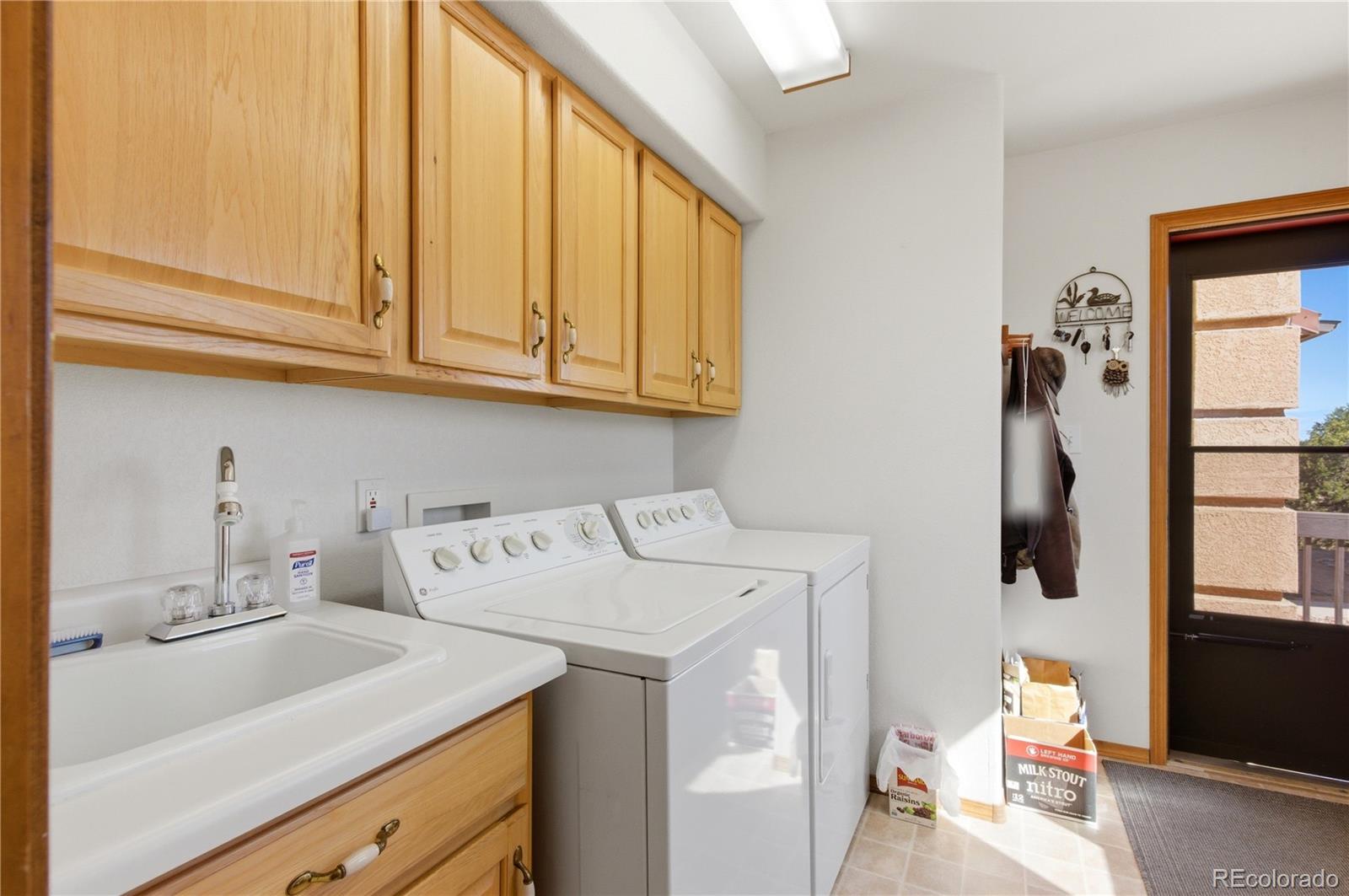 90 Riggs Road Westcliffe, CO 81252 - Photo 17 of 35 a utility room with dryer and washer