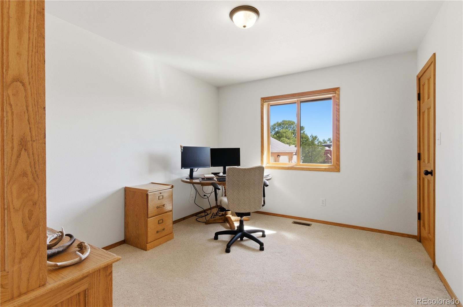 90 Riggs Road Westcliffe, CO 81252 - Photo 19 of 35 a view of workspace with gym equipment