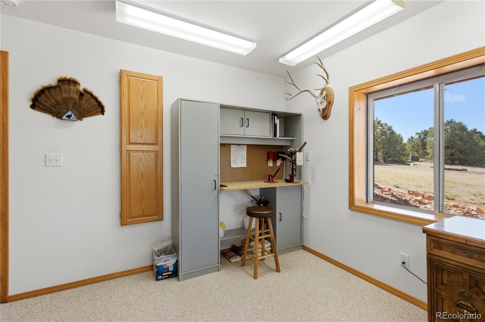 90 Riggs Road Westcliffe, CO 81252 - Photo 25 of 35 a view of workspace with window and furniture