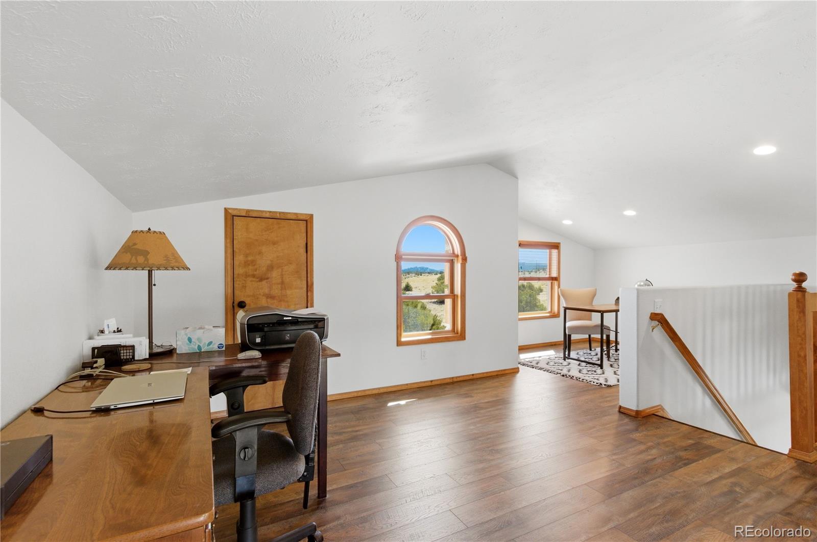 90 Riggs Road Westcliffe, CO 81252 - Photo 27 of 35 a view of a workspace with furniture and a window