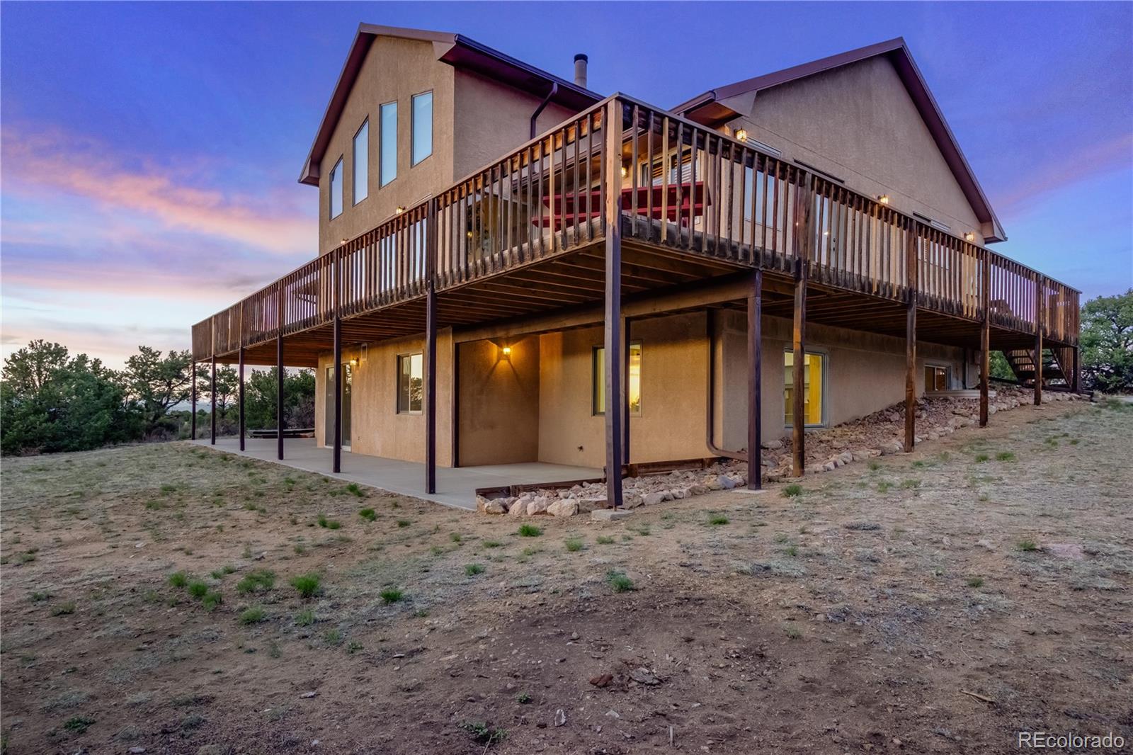 90 Riggs Road Westcliffe, CO 81252 - Photo 29 of 35 a view of a house with a yard