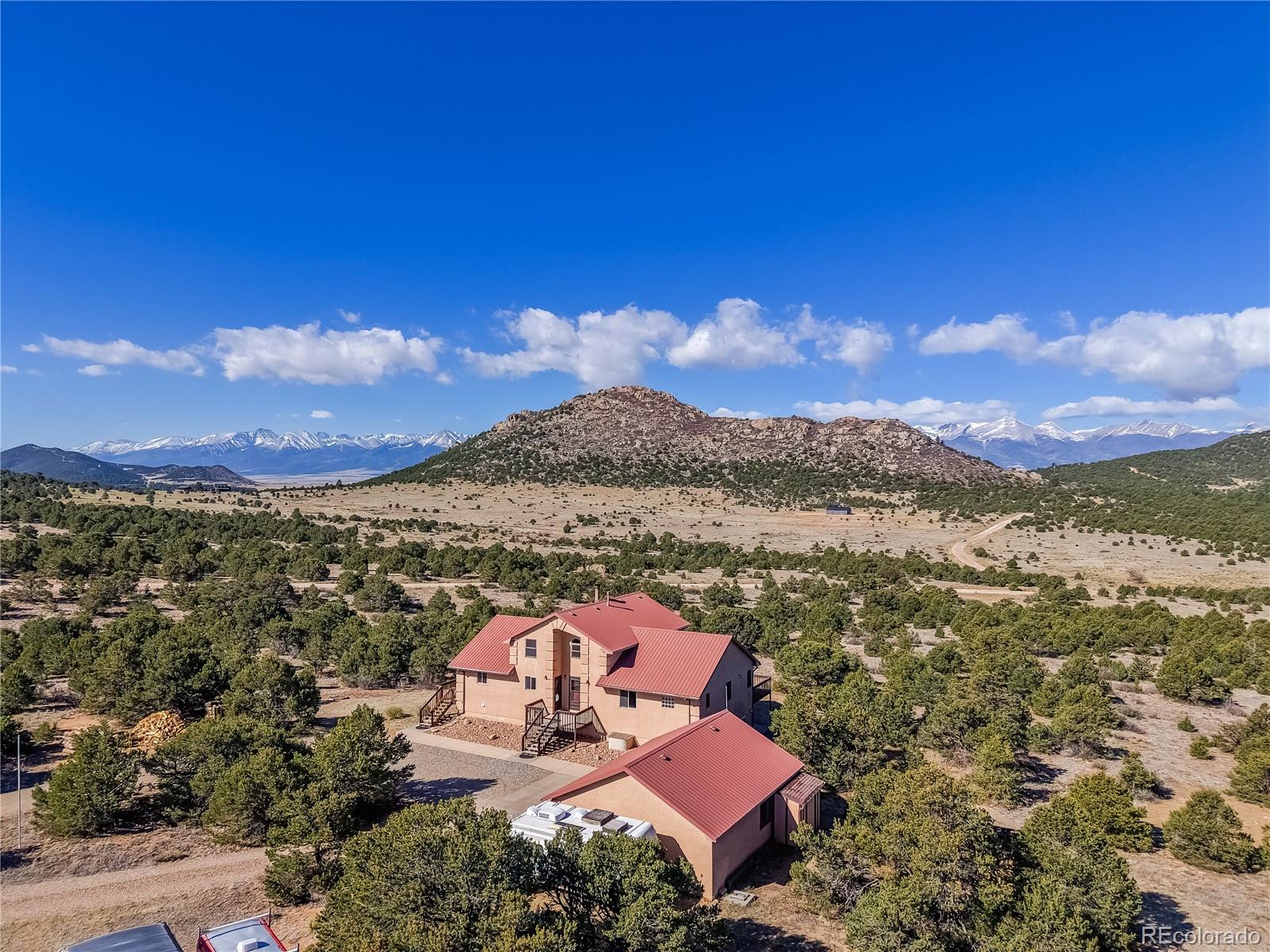 90 Riggs Road Westcliffe, CO 81252 - Photo 32 of 35 a view of a city with sunset view