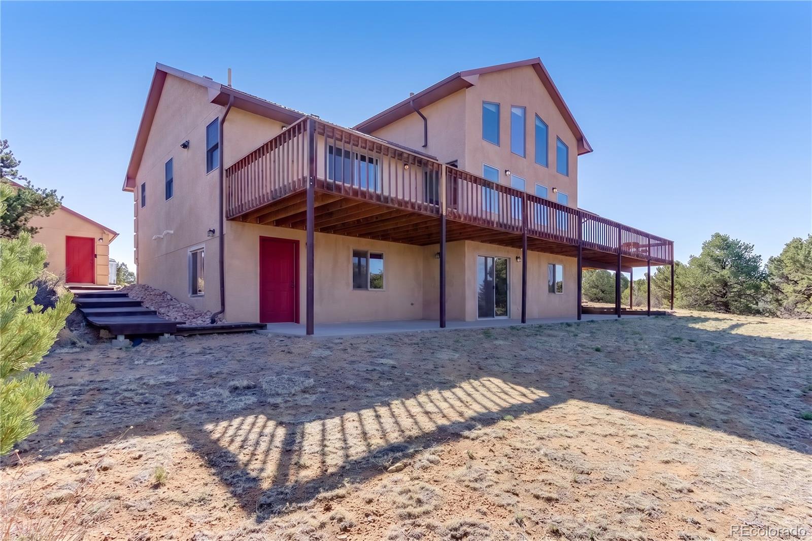 90 Riggs Road Westcliffe, CO 81252 - Photo 4 of 35 a view of a house with a yard