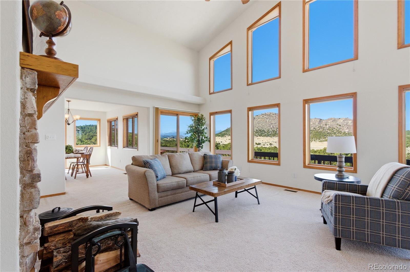90 Riggs Road Westcliffe, CO 81252 - Photo 5 of 35 a living room with furniture and a large window
