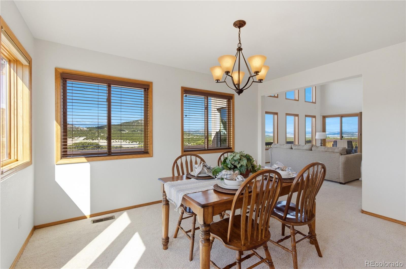 90 Riggs Road Westcliffe, CO 81252 - Photo 8 of 35 a view of a dining room with furniture window and wooden floor