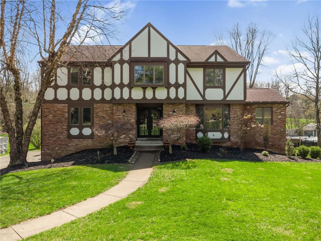 153 Oakwood Road Canonsburg, PA 15317 - Photo 1 of 26 a front view of a house with garden