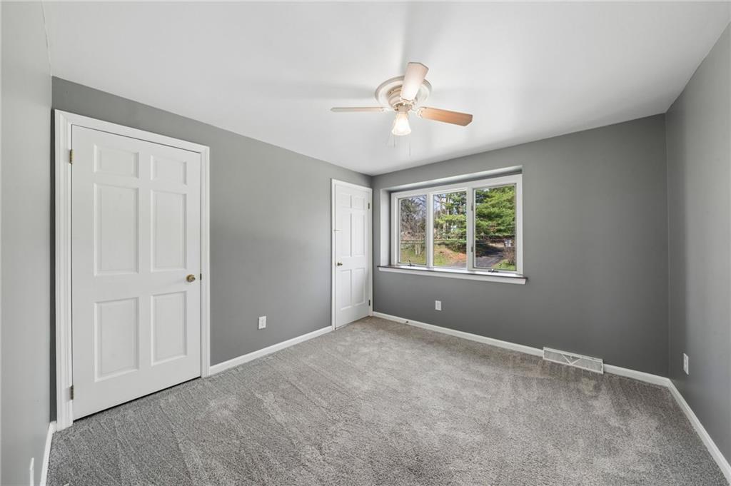 153 Oakwood Road Canonsburg, PA 15317 - Photo 13 of 26 a view of an empty room with window and chandelier fan