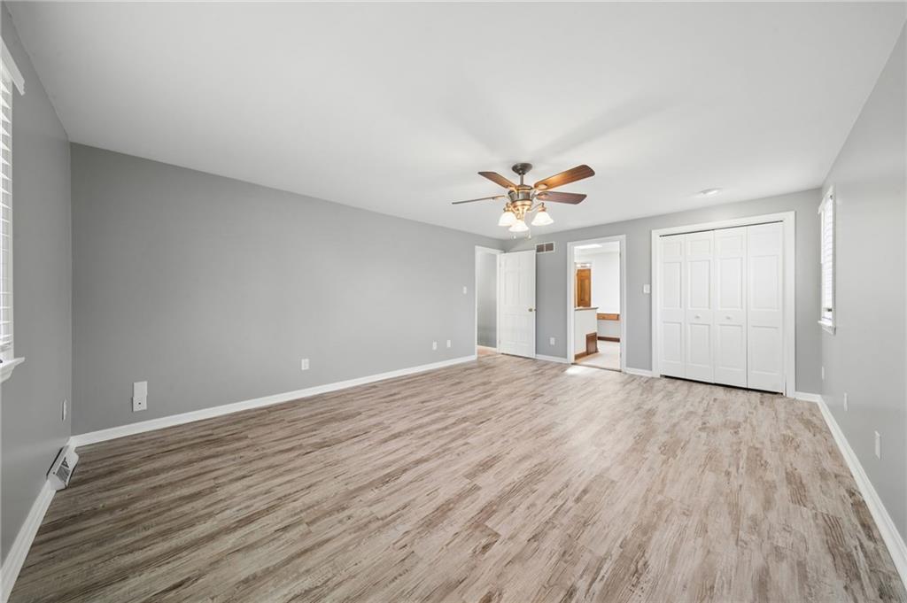 153 Oakwood Road Canonsburg, PA 15317 - Photo 16 of 26 a view of empty room with wooden floor and ceiling fan