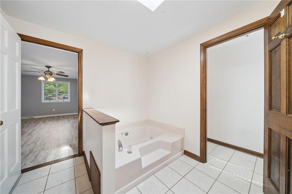 153 Oakwood Road Canonsburg, PA 15317 - Photo 18 of 26 a bathroom with a bathtub and a shower