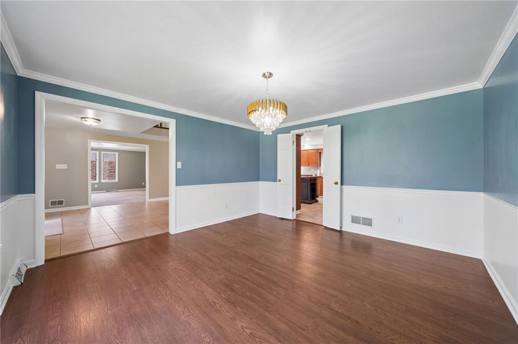 153 Oakwood Road Canonsburg, PA 15317 - Photo 4 of 26 a view of empty room with wooden floor and fan