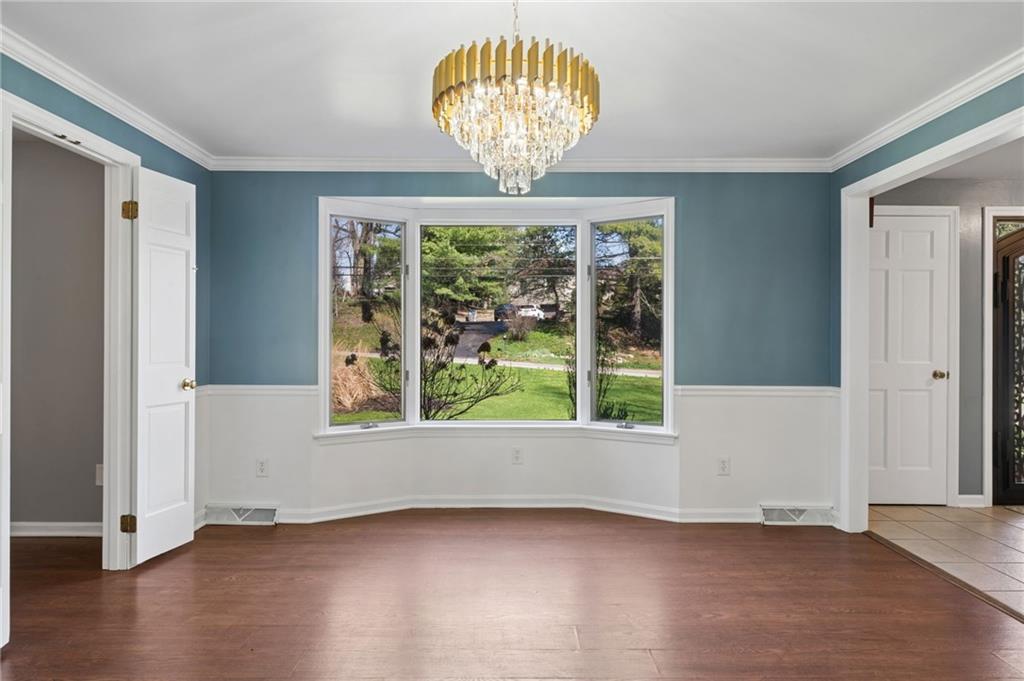 153 Oakwood Road Canonsburg, PA 15317 - Photo 5 of 26 an empty room with wooden floor and windows
