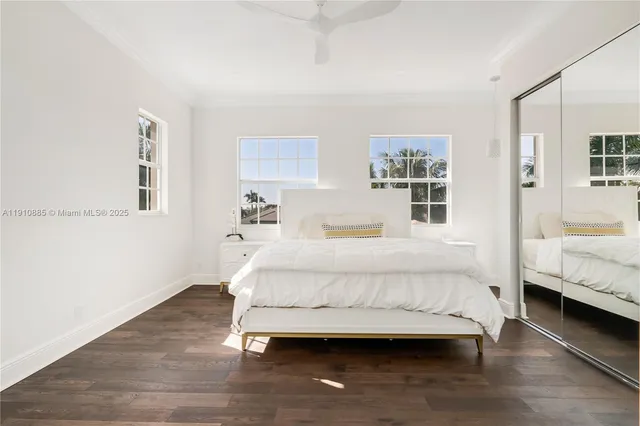 a spacious bedroom with a large bed and a window