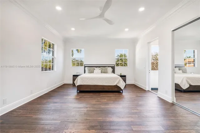 a bathroom with a tub a sink and a window