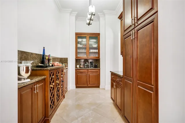 a bathroom with a granite countertop sink a toilet a mirror and shower