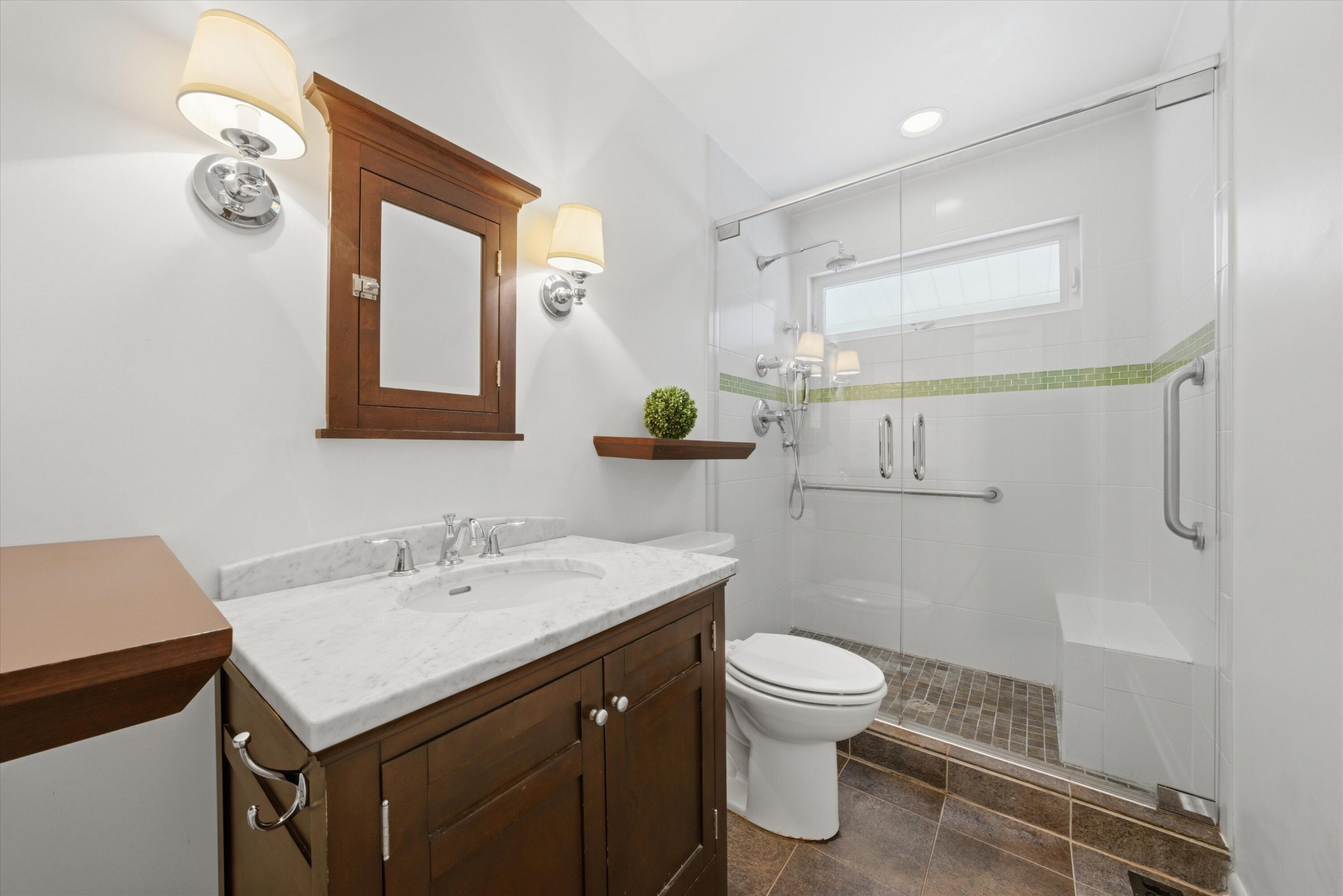 1034 North Indiana Street Griffith, IN 46319 - Photo 10 of 17 a bathroom with a sink toilet and a mirror