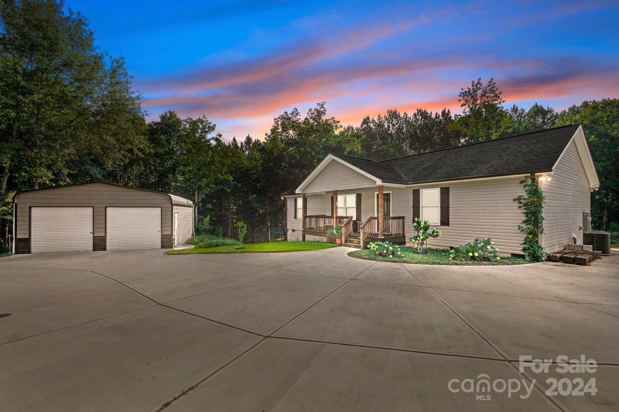 1455 Lawrence Road Clover, SC 29710 - Photo 1 of 35 a front view of a house with a yard and garage