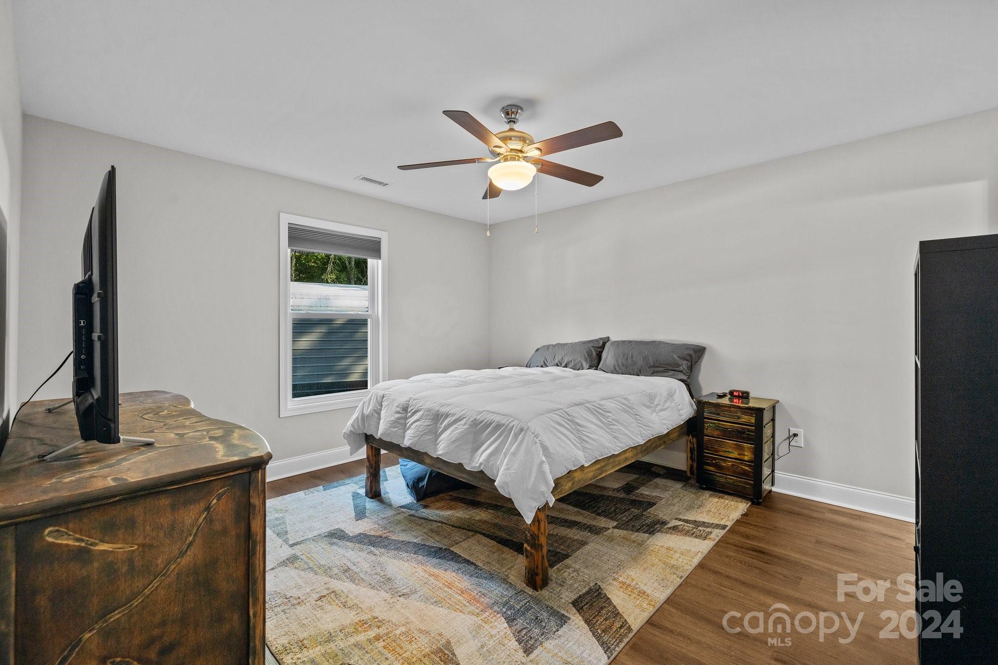 1455 Lawrence Road Clover, SC 29710 - Photo 13 of 35 a bedroom with a bed dresser and a window