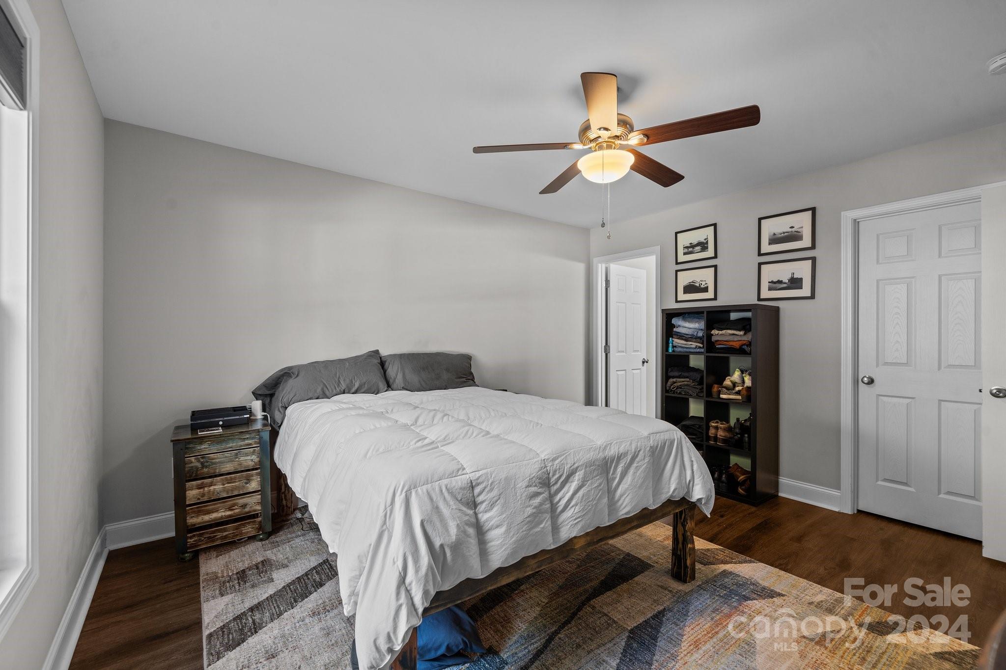 1455 Lawrence Road Clover, SC 29710 - Photo 14 of 35 a bedroom with a bed and a chandelier