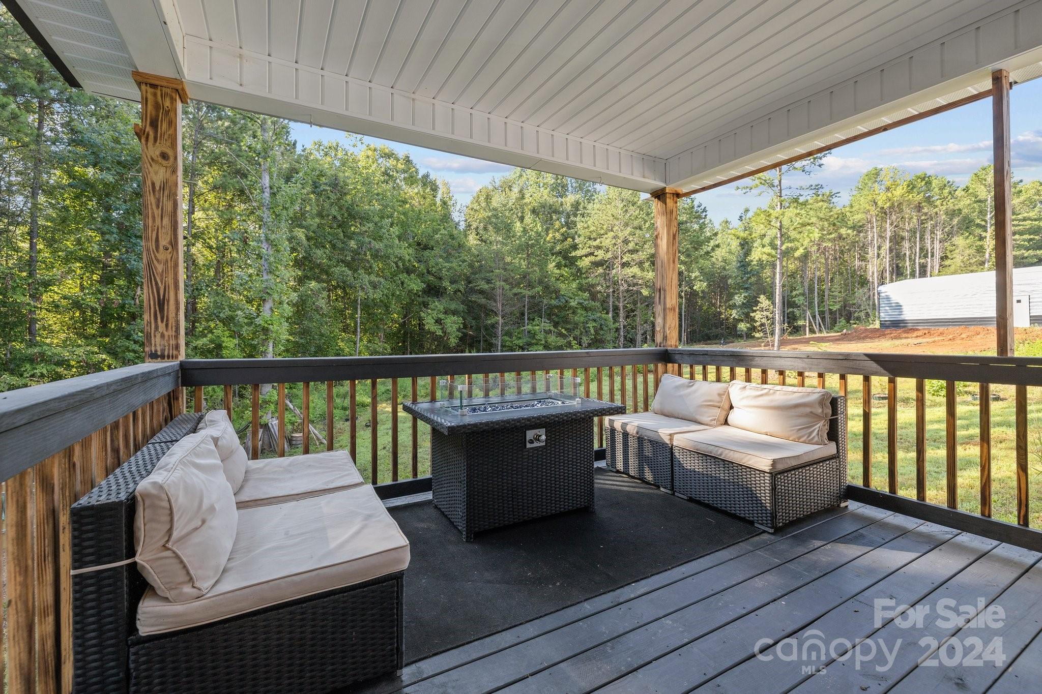 1455 Lawrence Road Clover, SC 29710 - Photo 23 of 35 a balcony with wooden floor and outdoor seating