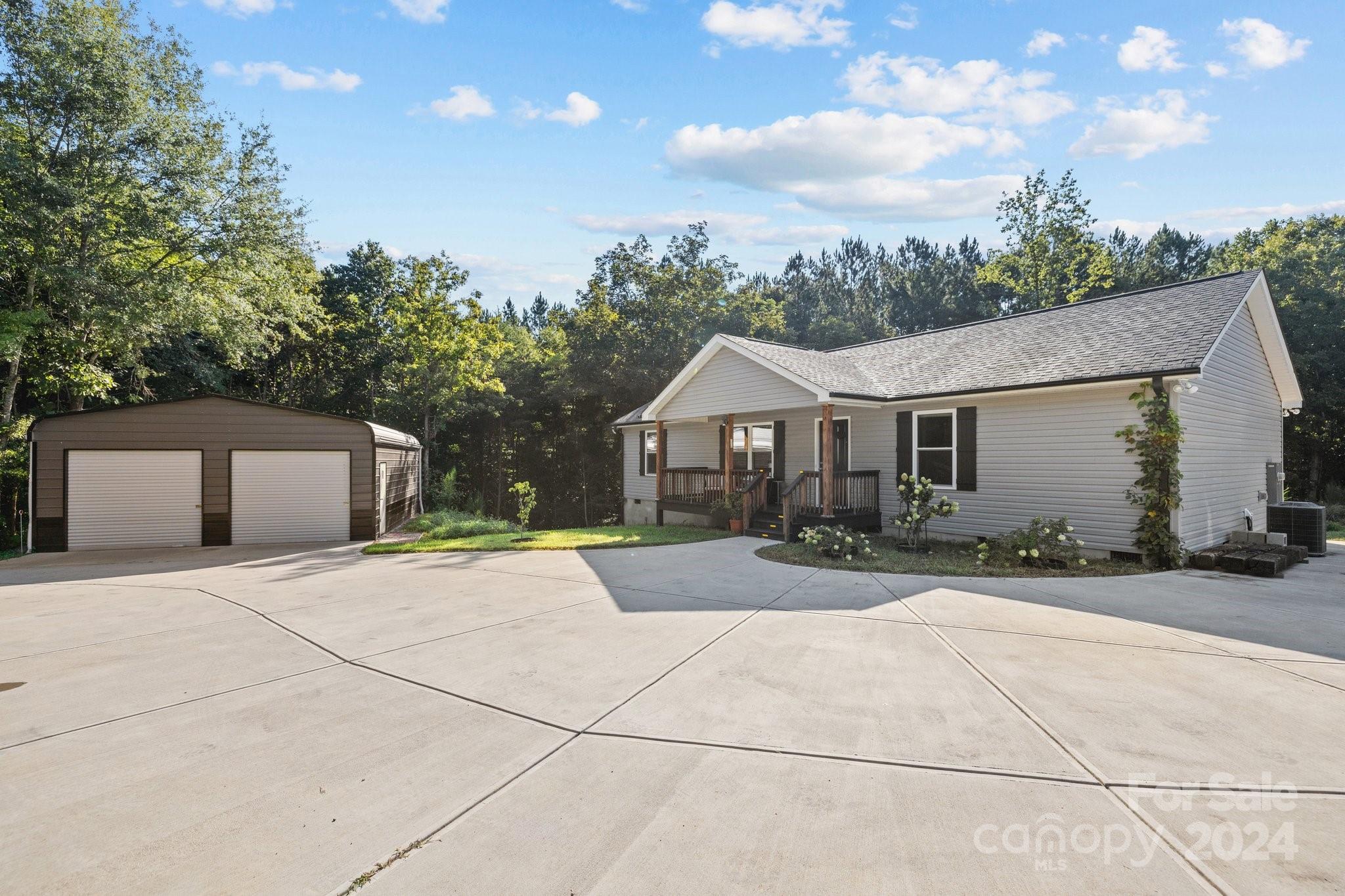 1455 Lawrence Road Clover, SC 29710 - Photo 27 of 35 a front view of house with yard and trees in the background