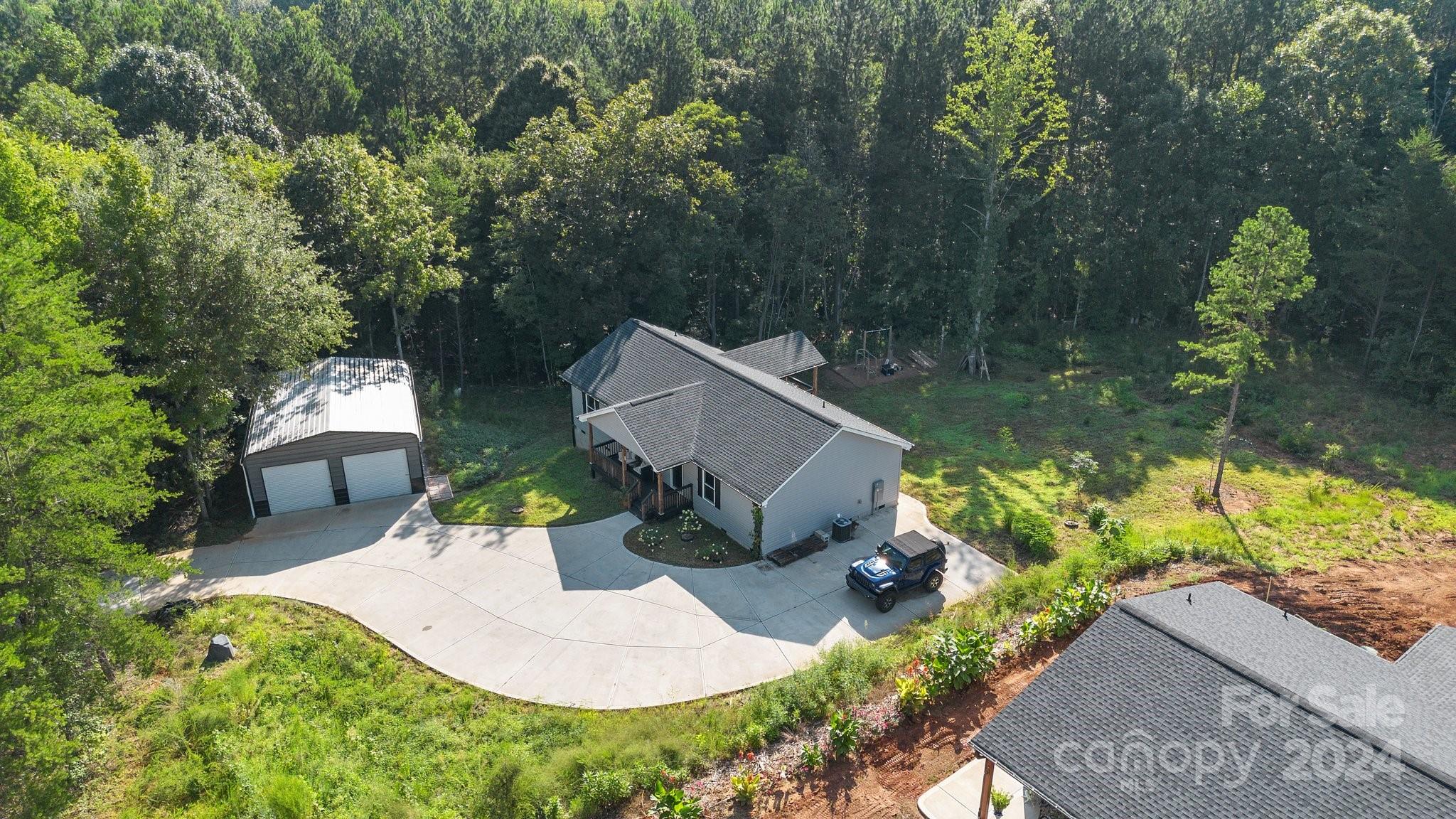 1455 Lawrence Road Clover, SC 29710 - Photo 29 of 35 an aerial view of a house with garden space and a patio