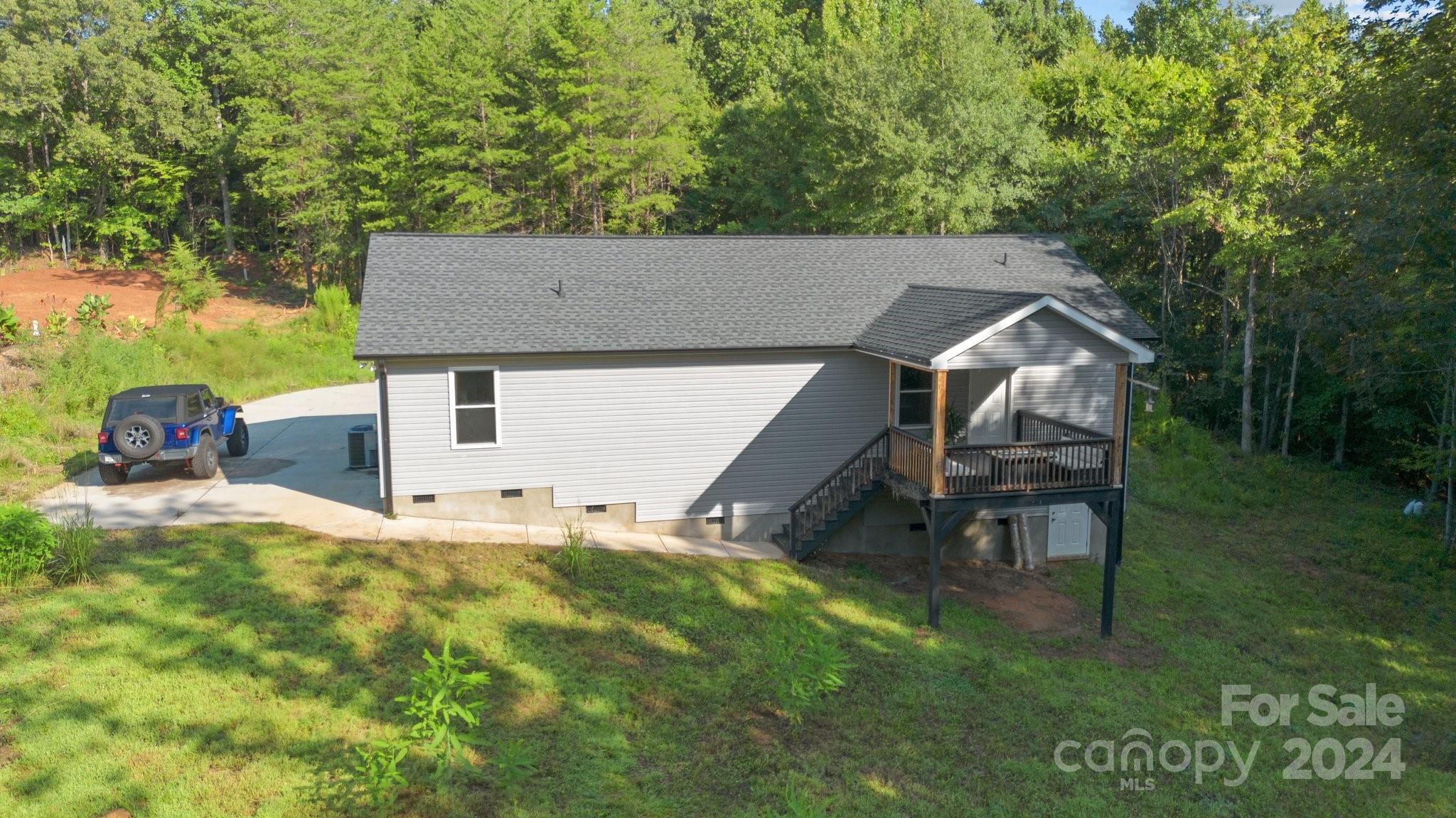 1455 Lawrence Road Clover, SC 29710 - Photo 30 of 35 a backyard of a house with table and chairs