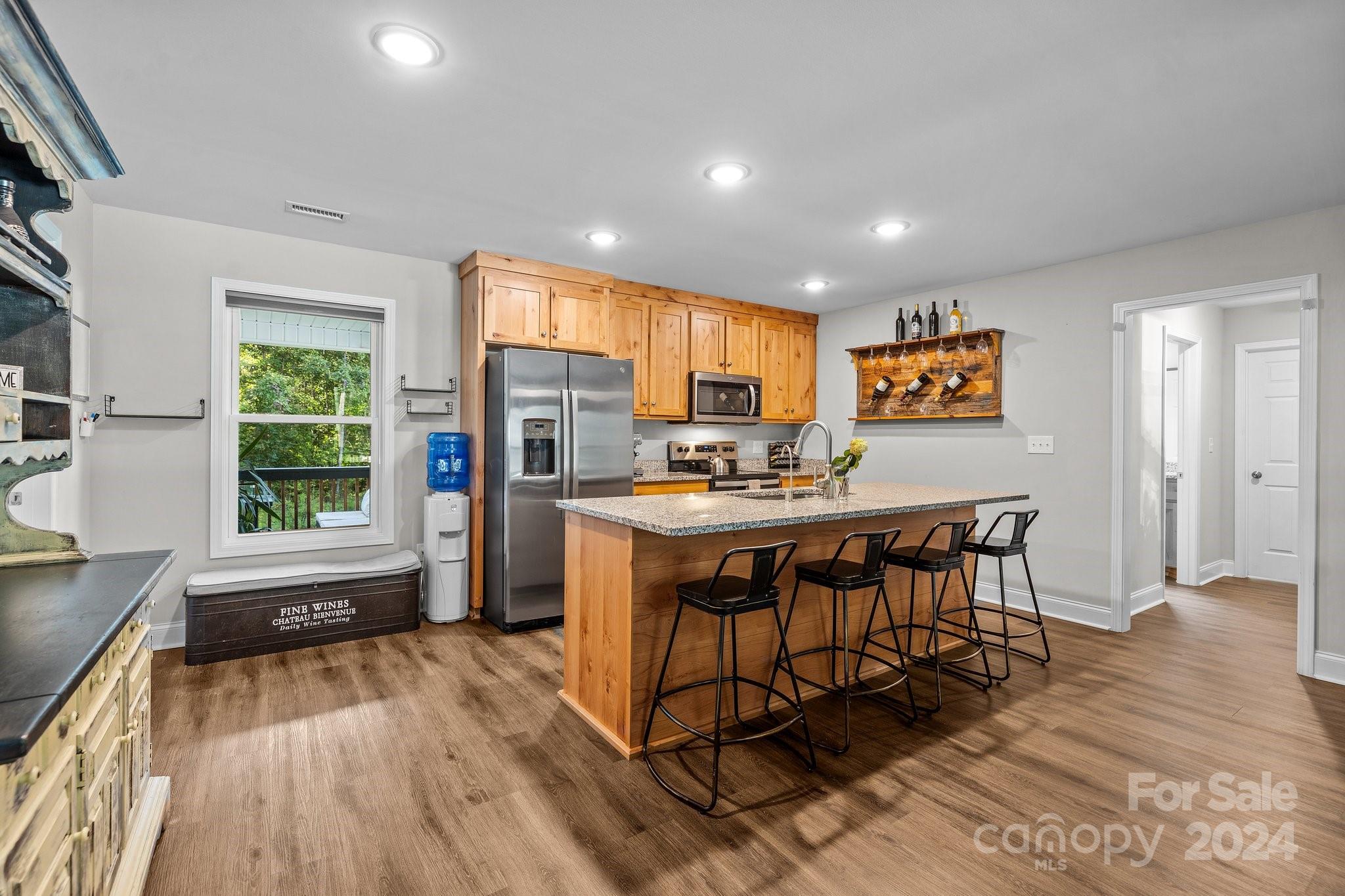 1455 Lawrence Road Clover, SC 29710 - Photo 6 of 35 a kitchen with a table chairs refrigerator and window