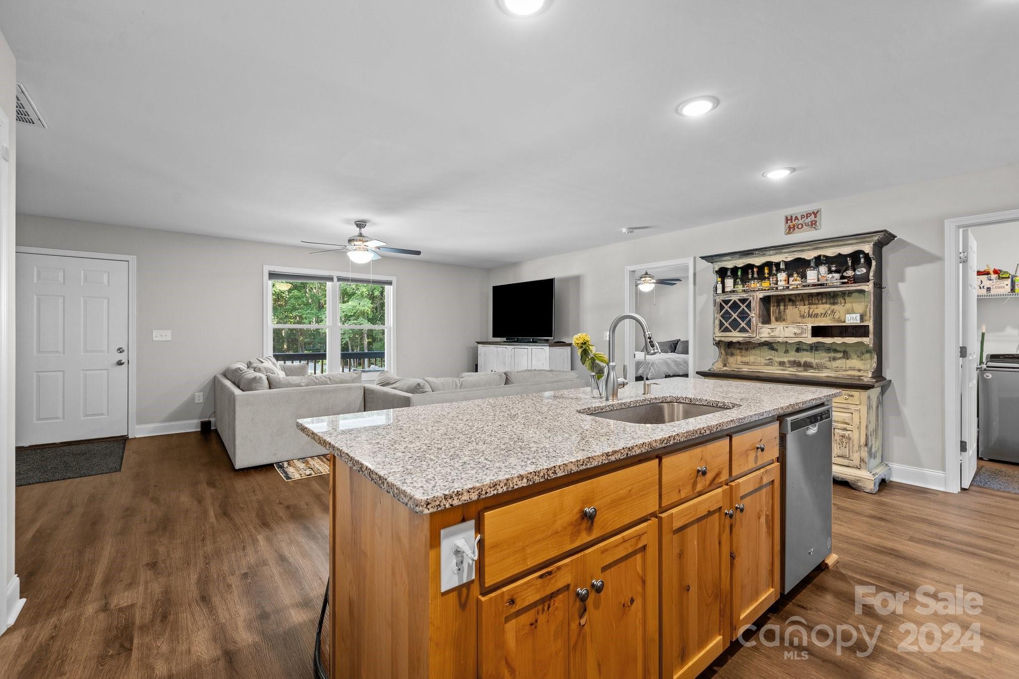 1455 Lawrence Road Clover, SC 29710 - Photo 9 of 35 a kitchen with stainless steel appliances granite countertop a sink stove and refrigerator