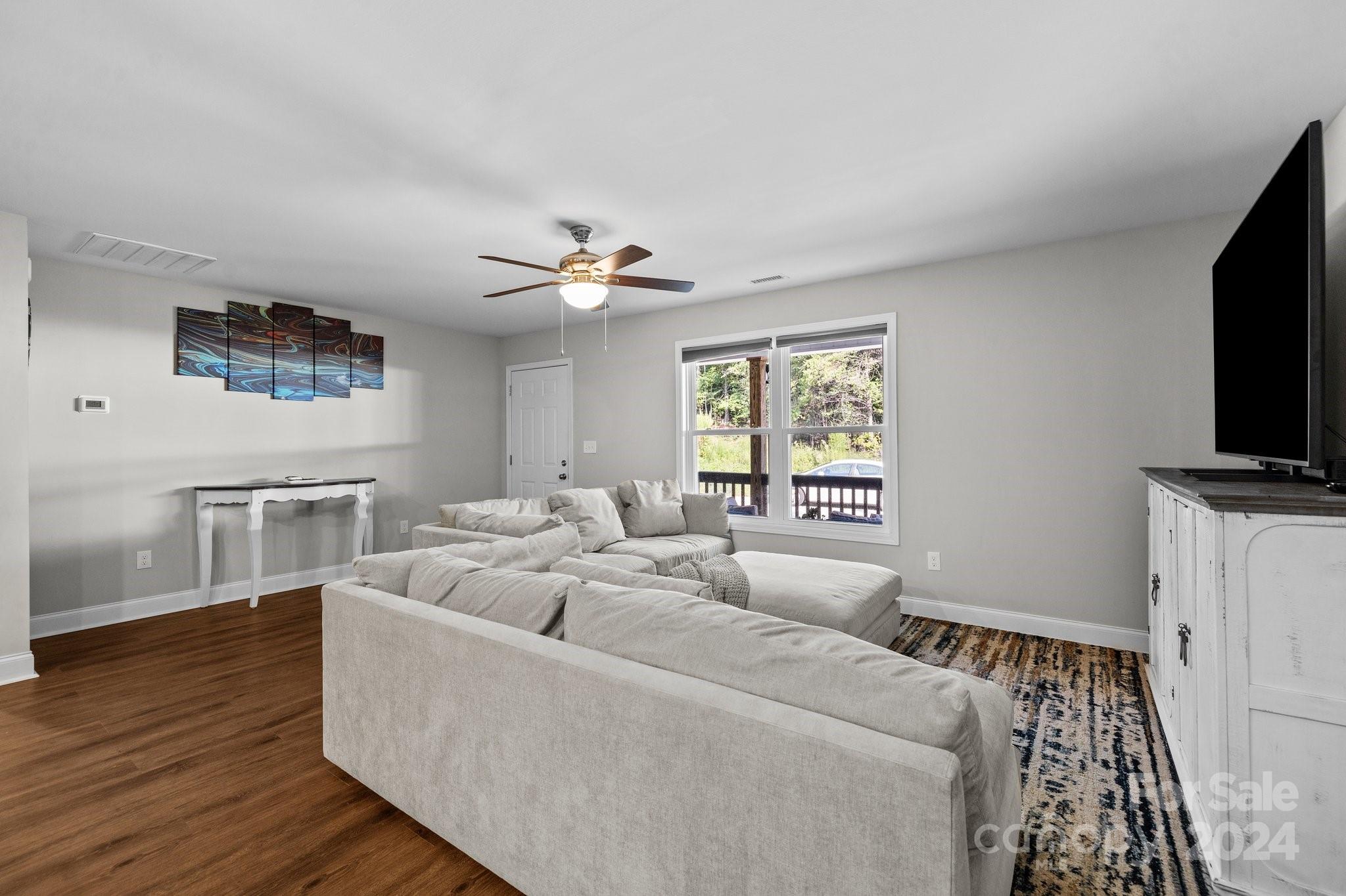 1455 Lawrence Road Clover, SC 29710 - Photo 10 of 35 a living room with furniture and a flat screen tv